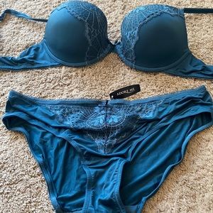 Adore Me bra and panty set.  Blue green set. Panties are size large NWT